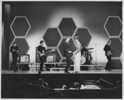 The Honeycombs Mark II line up with Viv Prince sitting in on drums. Honey Lantree standing next to Denis D'Ell performing That's The Way at The London Palladium. Remaining line up Peter Pye, Alan Ward, and John Lantree.